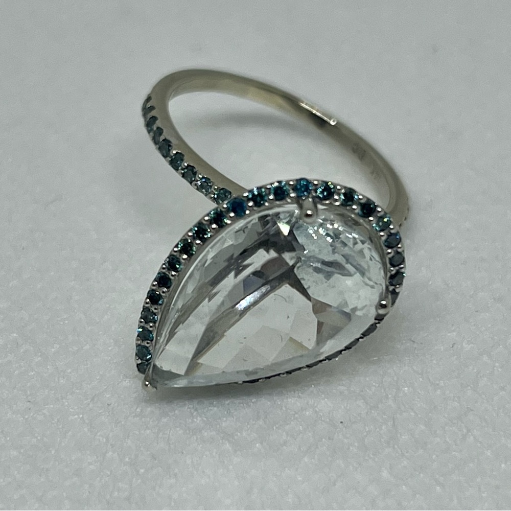 14 karat white gold , white Topaz & blue diamond cocktail Ring
